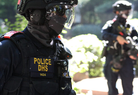 Police DHS officers in tactical gear on duty.