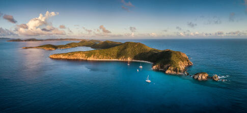 Aerial view of an island with surrounding blue ocean.